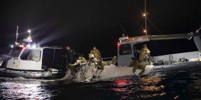 U.S. forces haul debris from China's surveillance balloon onto a boat off the coast of South Carolina. A military jet that shot down an object over Lake Huron, Michigan missed on its first attempt. 