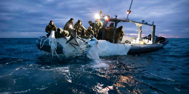 U.S. forces recover debris from a shot-down Chinese surveillance balloon.