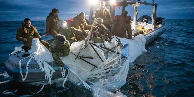 The US military carries the wreckage of a Chinese reconnaissance balloon to a boat off the coast of South Carolina.