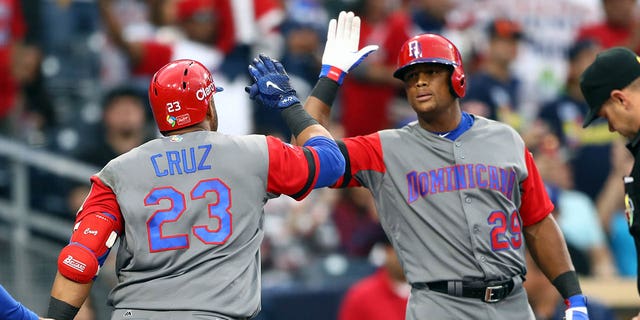 Nelson Cruz, #23 of Team Dominican Republic, celebrates with teammate Adrián Beltre, #29, after hitting a home run in the top of the second inning of Game 1 of Pool F of the 2017 World Baseball Classic against Team Dominican Republic. Puerto Rico on Tuesday.  March 14, 2017 at Petco Park in San Diego.