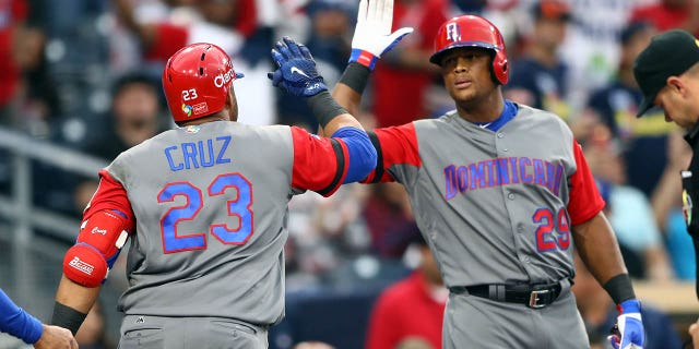 Nelson Cruz, #23 of Team Dominican Republic, celebrates with teammate Adrian Beltre, #29, after hitting a home run in the top of the second inning of Game 1 of Pool F of the 2017 World Baseball Classic against Team Puerto Rico on Tuesday, March 14, 2017 at Petco Park in San Diego.