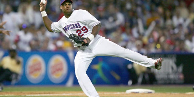 Adrian Beltre, #29 of the Dominican Republic, throws to first against Puerto Rico during the second round of the World Baseball Classic at Hiram Bithorn Stadium on March 12, 2006 in San Juan, Puerto Rico. Puerto Rico won 7-1.
