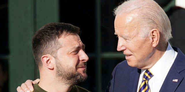 U.S. President Joe Biden welcomes Ukraine's President Volodymyr Zelenskyy on the South Lawn at the White House in Washington, U.S., December 21, 2022. REUTERS/Kevin Lamarque 