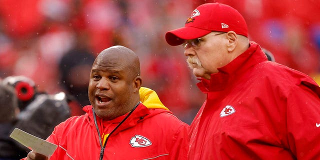 Chiefs offensive coordinator Eric Bieniemy talks with head coach Andy Reid before the AFC divisional playoff game against the Jacksonville Jaguars at Arrowhead Stadium on Jan. 21, 2023, in Kansas City, Missouri.