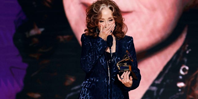 Bonnie Raitt accepts the Song Of The Year award for "Just Like That" during the Grammys. 