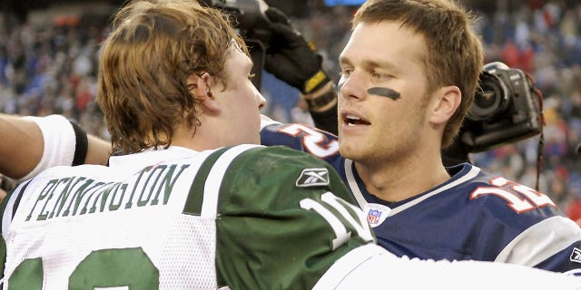 Tom Brady of the Patriots and Chad Pennington of the Jets hug after New England won the AFC wild-card matchup over New York, 37-16, at Gillette Stadium in Foxborough, Massachusetts, on Jan. 7, 2007.