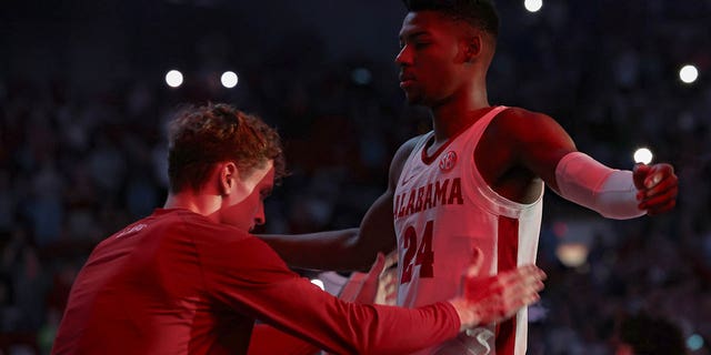 Brandon Miller #24 of the Alabama Crimson Tide is frisked by a teammate during player introductions before giving a call against the Kentucky Wildcats at Coleman Coliseum on January 7, 2023 in Tuscaloosa, Alabama. 