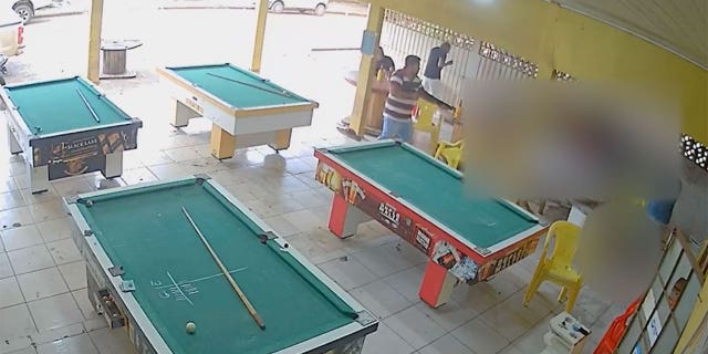 Surveillance video captured a shooting rampage at a Brazilian pool hall with some patrons seen scrambling for their lives.