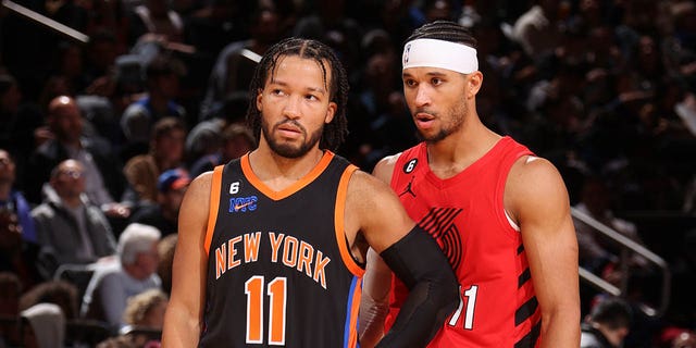 Jalen Brunson, #11 of the New York Knicks, talks to Josh Hart, #11 of the Portland Trail Blazers during the game at Madison Square Garden on November 25, 2022 in New York City.