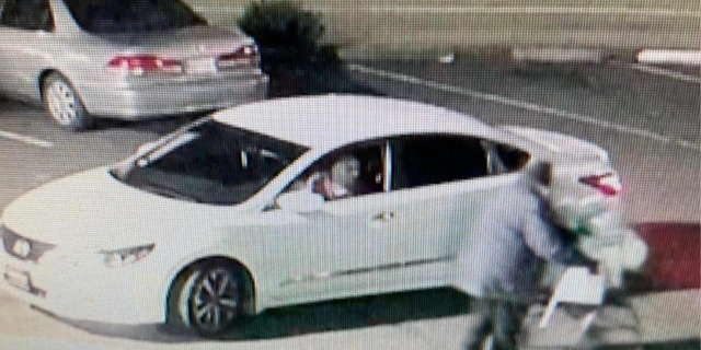 A homeless elderly woman in California pushes grocery cart before being hit by car.