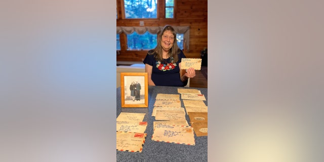 Carol Bohlin holds World War II-era love letters that her parents sent to one another nearly 80 years ago.