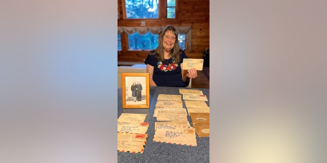 Carol Bohlin holds World War II-era emotion letters that her parents sent to 1 different astir 80 years ago.