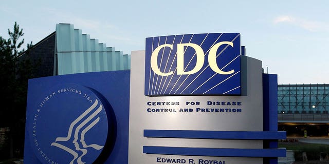 A sign depicting the Centers for Disease Control and Prevention stands in front of its headquarters in Atlanta, Georgia, on Sept. 30, 2014. The CDC reported that U.S. Blacks and Hispanics are more likely to get infected during kidney dialysis compared to white patients.
