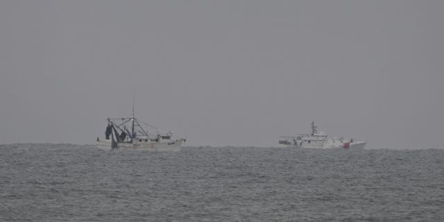 Ships scan the sea during efforts to retrieve and recover the Chinese spy balloon after Chinese spy balloon was shot down in Myrtle Beach, South Carolina, Feb. 5, 2023.