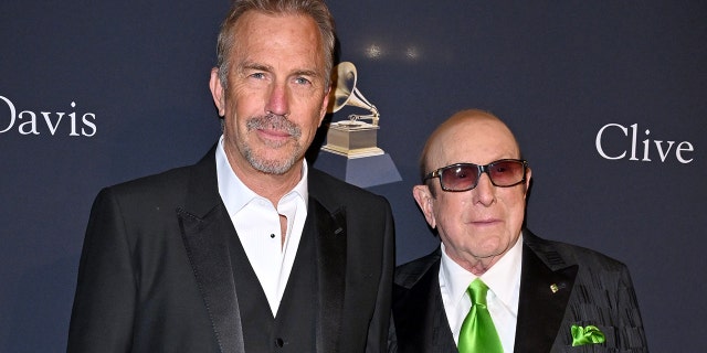 Kevin Costner, left, and Clive Davis attend the Pre-Grammy Gala on Saturday night.