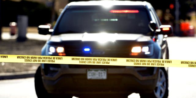 A Denver Police cruiser at a shooting investigation in 2021