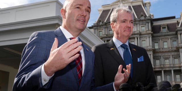 National Governors Association Vice Chair Gov. Spencer Cox, of Utah, and Chair Gov. Phil Murphy of N.J., right, speak to reporters outside the West Wing of the White House