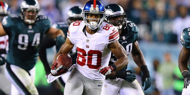 Victor Cruz (80) of the New York Giants runs with the ball after a catch against the Philadelphia Eagles during a game at Lincoln Financial Field Sept. 30, 2012, in Philadelphia.  