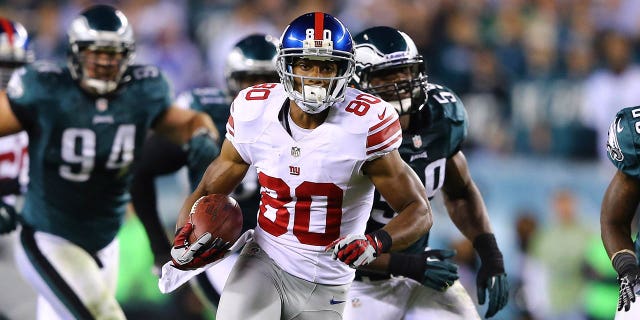 Victor Cruz (80) of the New York Giants runs with the ball after a catch against the Philadelphia Eagles during a game at Lincoln Financial Field Sept. 30, 2012, in Philadelphia.  