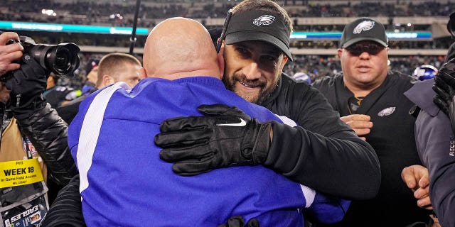 Head coach Nick Sirianni of the Eagles hugs Giants' head coach Brian Daboll after Philadelphia beat New York, 22-16, at Lincoln Financial Field on Jan. 8, 2023.
