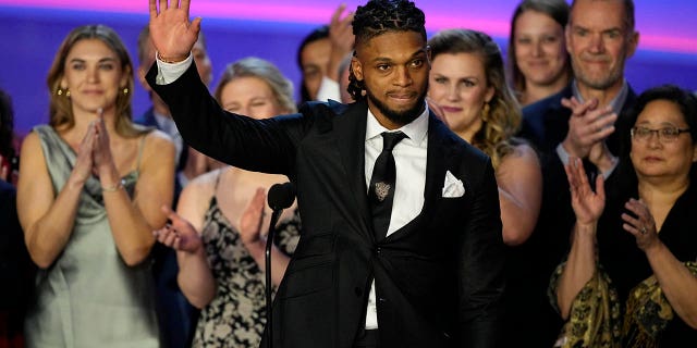 Damar Hamlin of the Buffalo Bills speaks in front of staff at the University of Cincinnati Medical Center during the NFL awards ceremony before a Super Bowl LVII football game, Thursday, Feb. 9, 2023, in Phoenix.