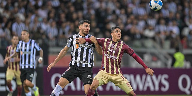 Junior Alonso, left, of Atletico Mineiro and Daniel Cataño, right, of Deportes Tolima fight for the ball during a match between Atletico Mineiro and Deportes Tolima as part of Copa CONMEBOL Libertadores 2022 at Mineirao Stadium on May 25, 2022 in Belo Horizonte, Brazil.