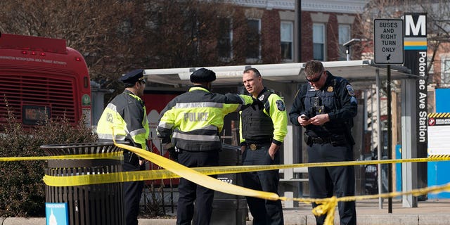 Washington Metropolitan Police officers investigate a shooting at the Potomac Avenue subway station in southeast Washington on Wednesday, February 1, 2023.  31-year-old Isaiah Trotman was detained for riots. 