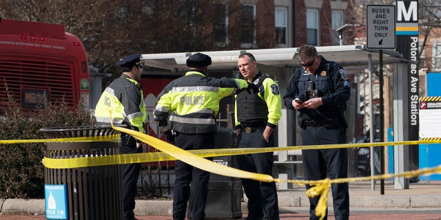 Washington Metropolitan Police officers investigate a shooting at Potomac Avenue Metro Station, in Southeast Washington, Wednesday, Feb. 1, 2023.  Isaiah Trotman, 31, is in custody for the rampage. 