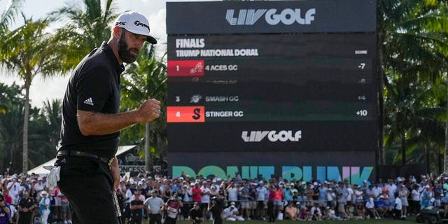 Dustin Johnson raises his fist after sinking the winning putt during the stroke play round of the LIV Golf Invitational - Miami Team Championship on October 30, 2022c in Doral, Florida.