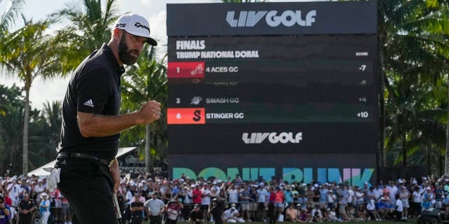 Dustin Johnson raises his fist after sinking the winning putt during the stroke play round of the LIV Golf Invitational - Miami Team Championship on October 30, 2022c in Doral, Florida.