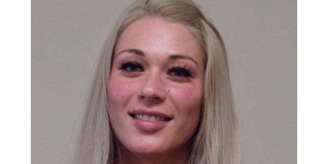 This booking photo provided by the Lyon County Sheriff's Office shows Savannah Henderson, 28, of Dayton, Nev., following her arrest early Tuesday, Feb. 21, 2023.
