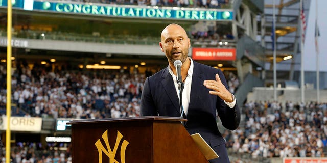 Baseball Hall of Famer Derek Jeter speaks to the fans as he is honored by the New York Yankees before a game against the Tampa Bay Rays at Yankee Stadium on September 9, 2022, in the Bronx borough of New York City.