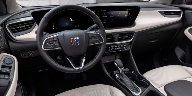 The interior is equipped with a dual-monitor Virtual Cockpit System.
