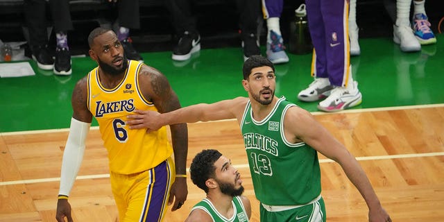 LeBron James #6 of the Los Angeles Lakers and Enes Kanter #13 of the Boston Celtics look to recover on November 19, 2021 at the TD Garden in Boston, Massachusetts.