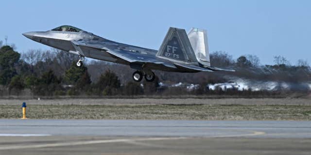 An F-22 fighter jet takes off from Langley Air Force Base. 