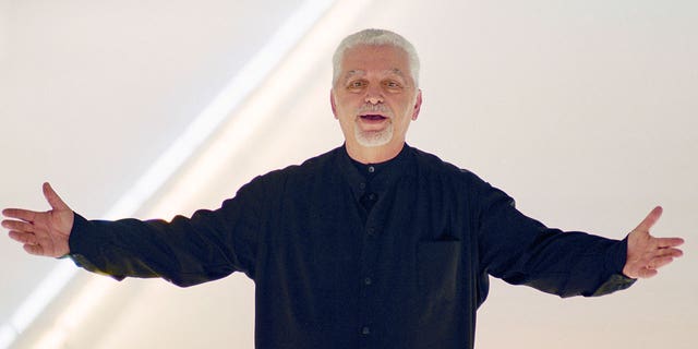 Fashion designer Paco Rabanne acknowledges applause at the end of his fall-winter collection March 3, 2000 in Paris, France.