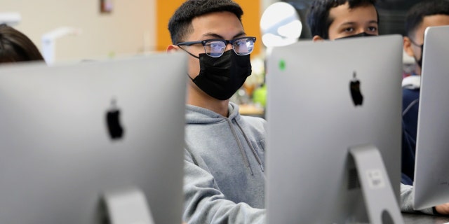 Students in the Exploring Computer Science class listen to Superintendent Alberto M. Carvalho, Los Angeles Unifed School District, while Carvalho tours Maywood Center For Enriched Studies Magnet school, Feb. 16, 2022, in Maywood, California.