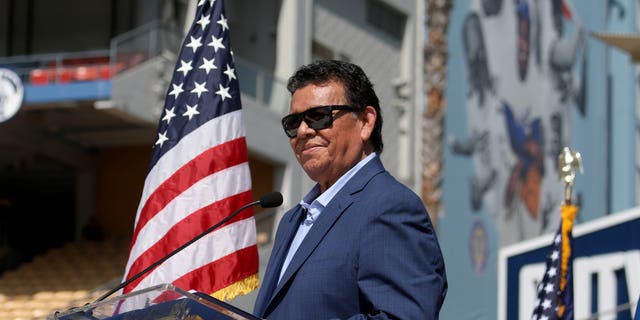Fernando Valenzuela receives the Outstanding Americans by Choice recognition award during a special naturalization ceremony at Dodger Stadium on August 29, 2022 in Los Angeles.
