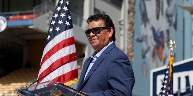 Fernando Valenzuela receives the Outstanding Americans by Choice recognition award during a special naturalization ceremony at Dodger Stadium on August 29, 2022 in Los Angeles.