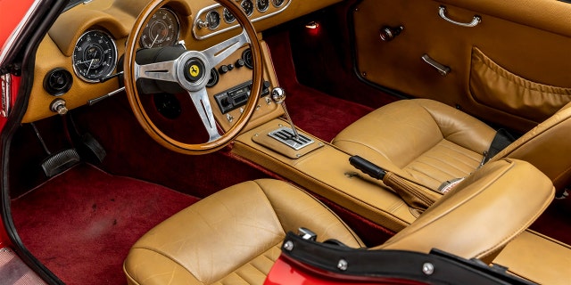 The interior has a faux manual transmission gear shift for its automatic.
