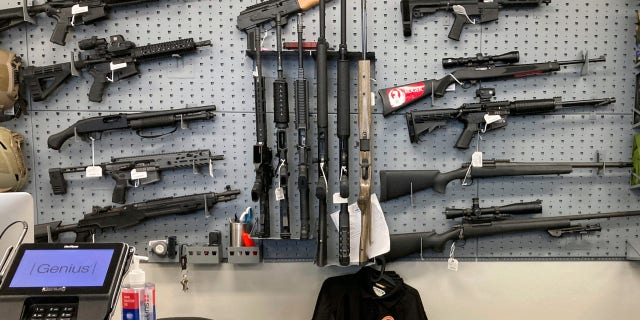 Guns are displayed at a shop in Salem, Ore., Feb. 19, 2021.