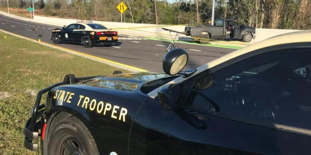 The Florida trooper was shot just below his bullet-proof vest and "seems to be doing well" after surgery, Florida Highway Patrol Director Gene Spaulding said.