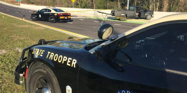 The Florida trooper was shot just below his bullet-proof vest and "seems to be doing well" after surgery, Florida Highway Patrol Director Gene Spaulding said.