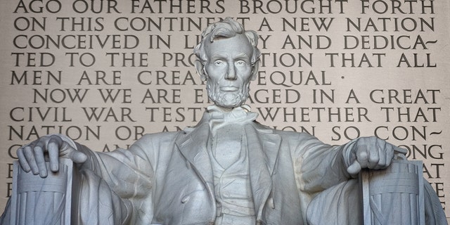 The Gettysburg Address can be seen behind the 19-foot-tall statue of Abraham Lincoln in the Lincoln Memorial in Washington, D.C.