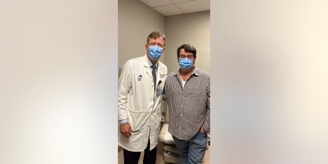 Dr.  John Puskas (left) and cardiologist David Holland from New York.  Holland said he is recovering well from surgery last November. 