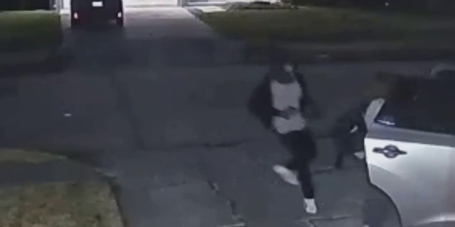 The suspect approached the mother from behind and demanded her property, police said.