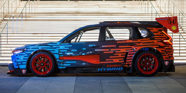 Downforce-production aerodynamic elements are part of the design.
