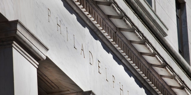 Marble building entrance with the name of the city of Philadelphia engraved.