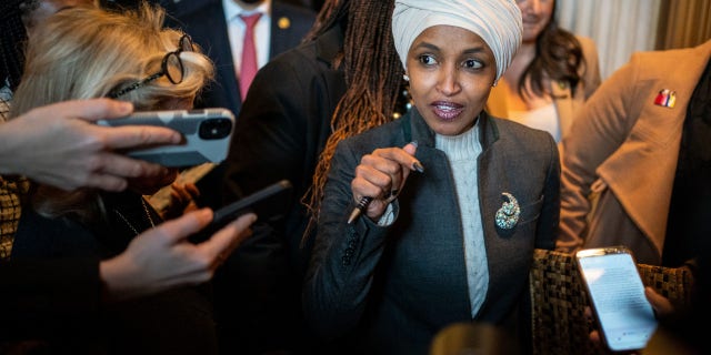 Rep. Ilhan Omar, D-Minn., leaves the House Chamber in the Capitol in Washington, D.C., following a vote to oust her from the Foreign Affairs Committee on Thursday.