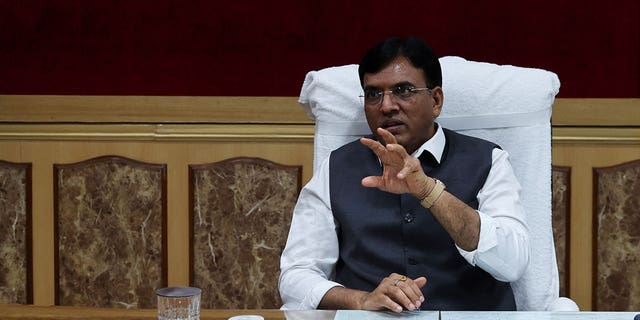 India's Chemicals and Fertilizers Minister Mansukh Mandaviya gestures during his interview at his office in New Delhi on July 15, 2022.